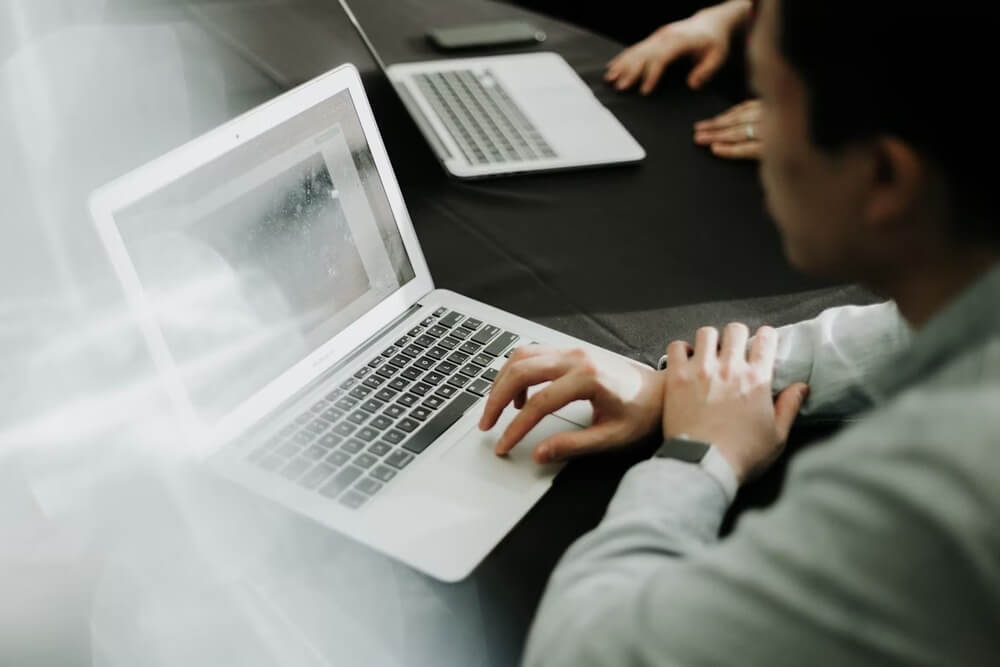 A corporate businessperson using a laptop computer