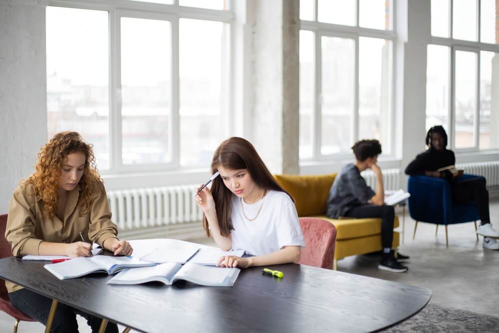 Students sat at a table studying